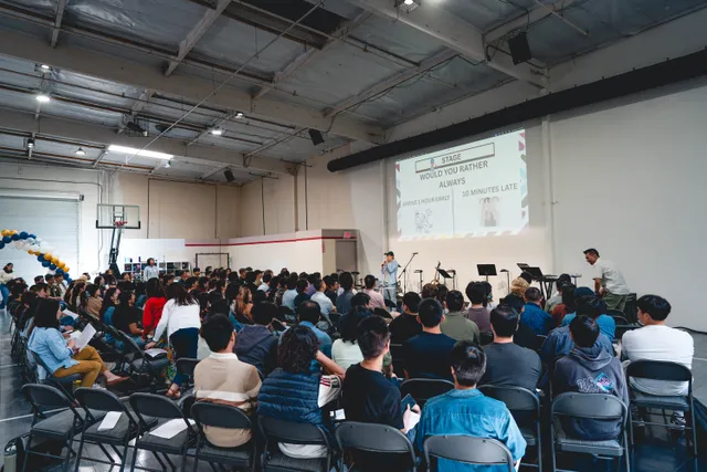 Full room of students seated for the Sunday gathering