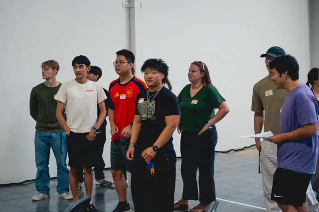 Leaders and volunteers introduced at the front of the room