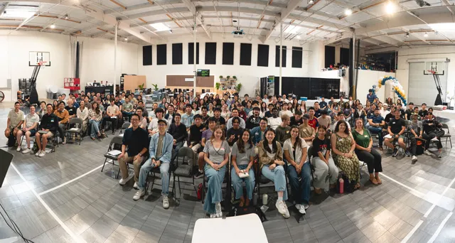Panoramic view of the full room gathered for Sunday service