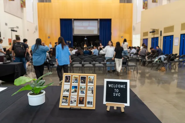 Welcome to SVC table with the auditorium and stage in the background