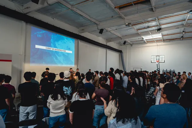 Students worshiping together during Sunday service
