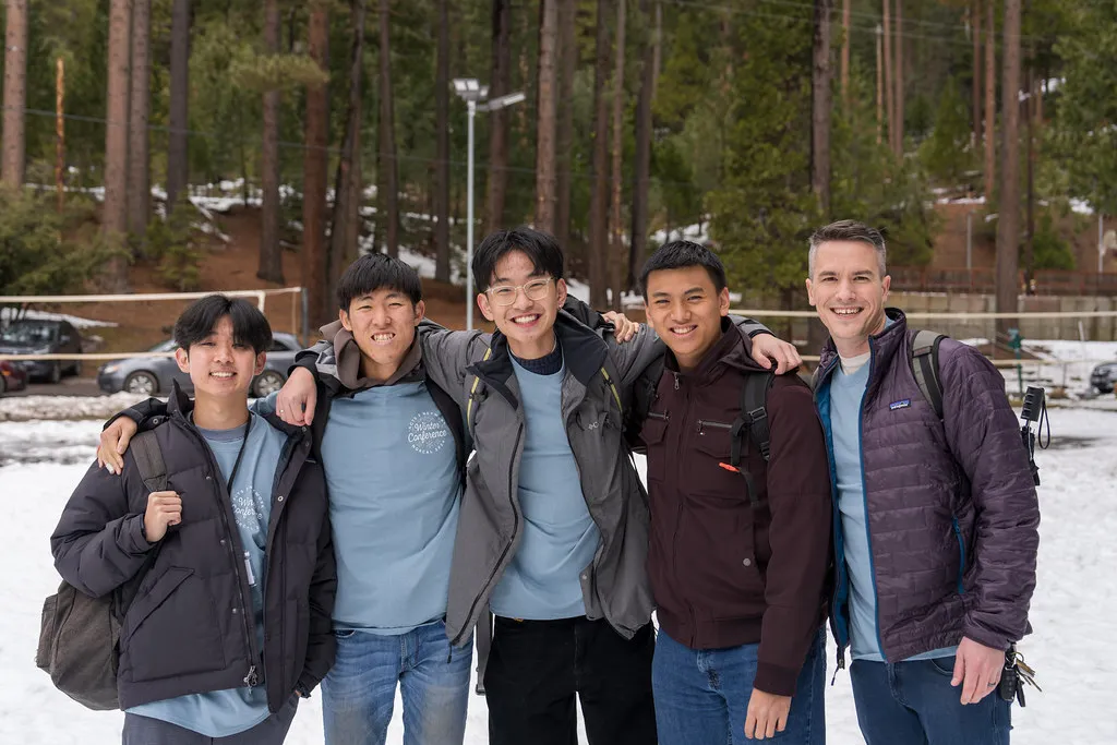 Klesis students posing together in the snow at the NorCal Winter Conference